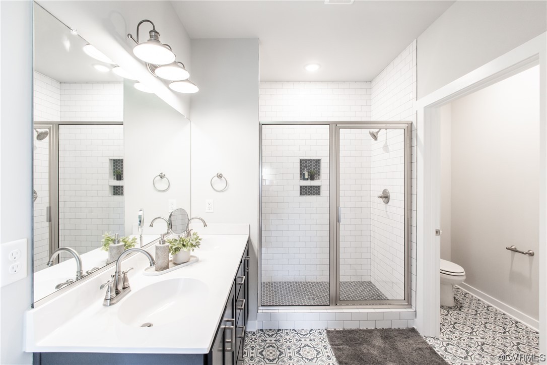 13140 Beach Road Chesterfield, VA 23832 - Photo 20 of 34 a bathroom with a sink a toilet and shower