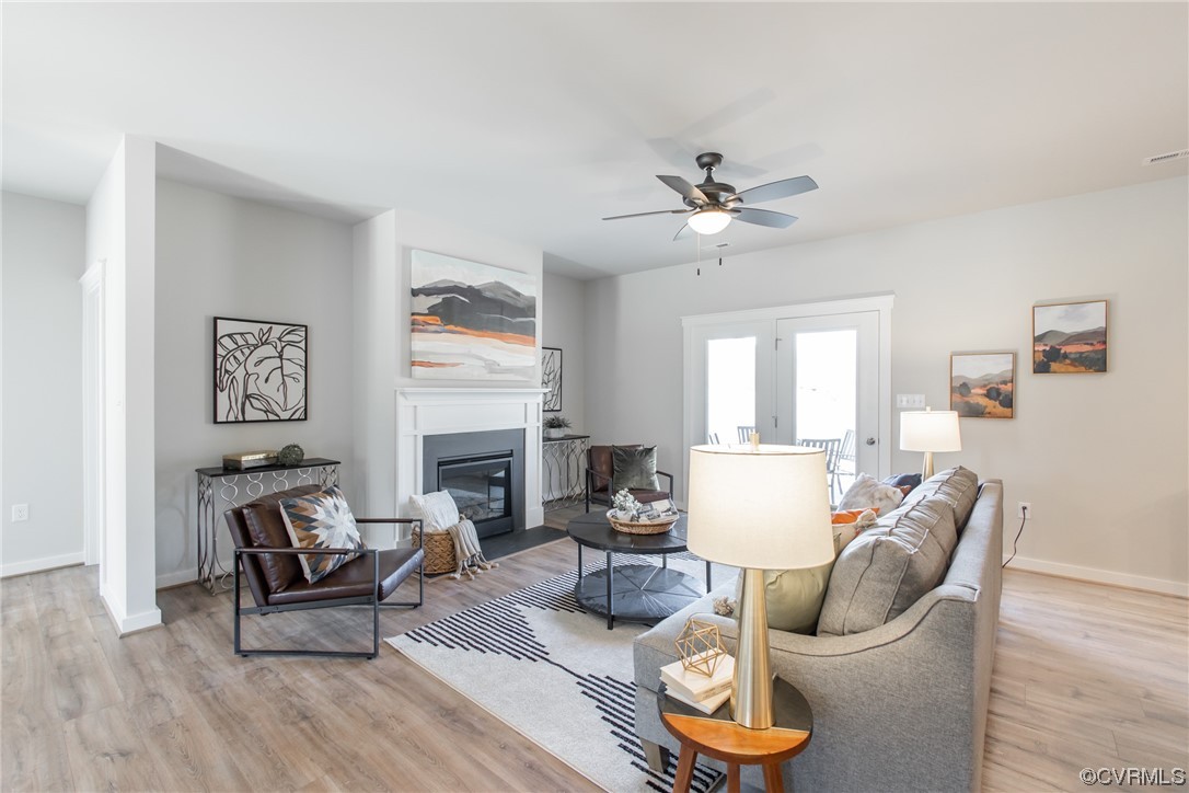 13140 Beach Road Chesterfield, VA 23832 - Photo 5 of 34 a living room with furniture a fireplace and a large mirror