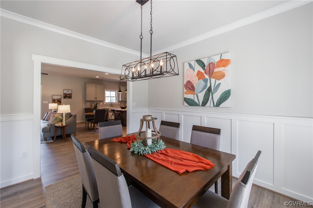 13140 Beach Road Chesterfield, VA 23832 - Photo 8 of 34 a view of a dining room with furniture wooden floor and chandelier