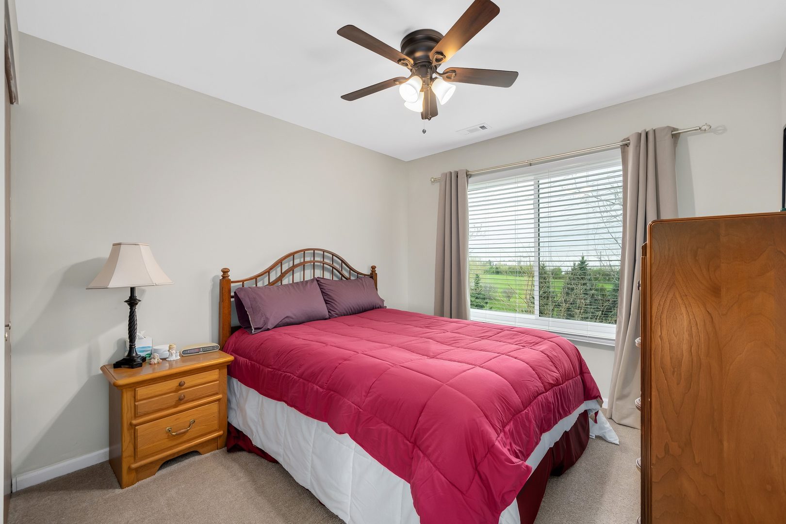 772 Rebecca Lane Bolingbrook, IL 60440 - Photo 22 of 27 a bedroom with a bed and a chandelier