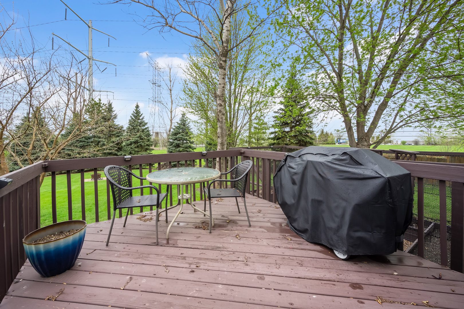 772 Rebecca Lane Bolingbrook, IL 60440 - Photo 23 of 27 a view of a patio with table and chairs and wooden floor