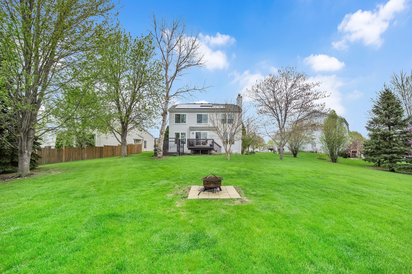 772 Rebecca Lane Bolingbrook, IL 60440 - Photo 27 of 27 a house with huge green field in front of it