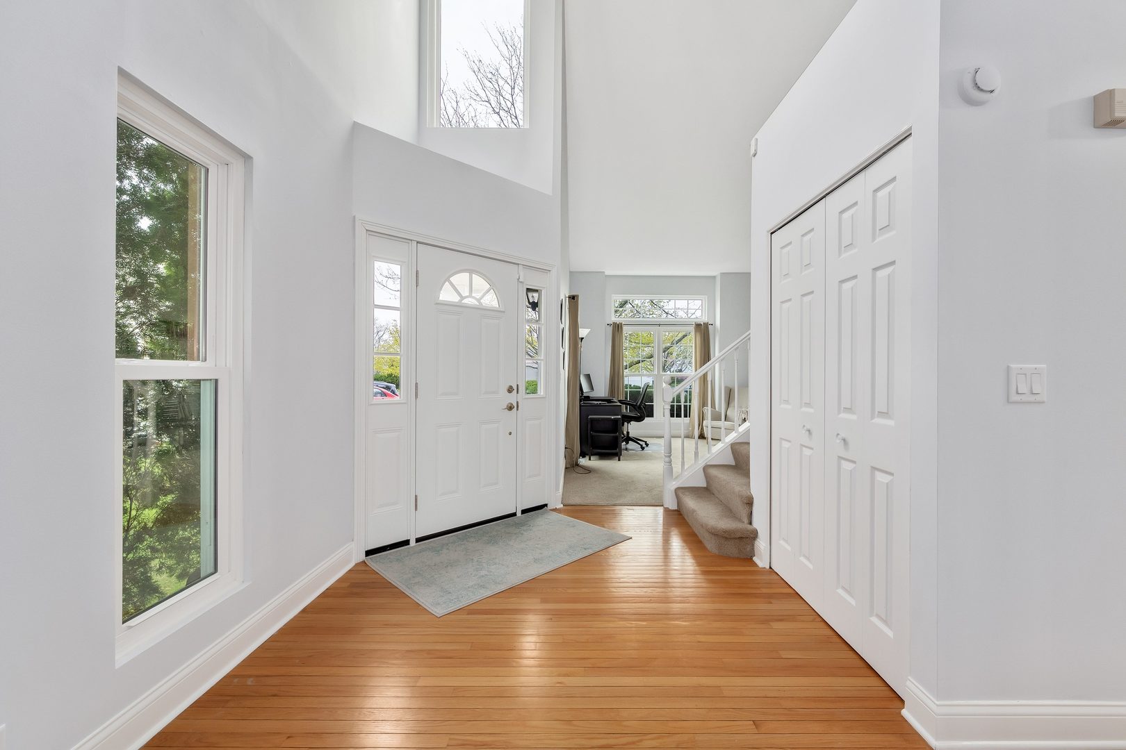 772 Rebecca Lane Bolingbrook, IL 60440 - Photo 4 of 27 a view of entryway with livingroom and wooden floor