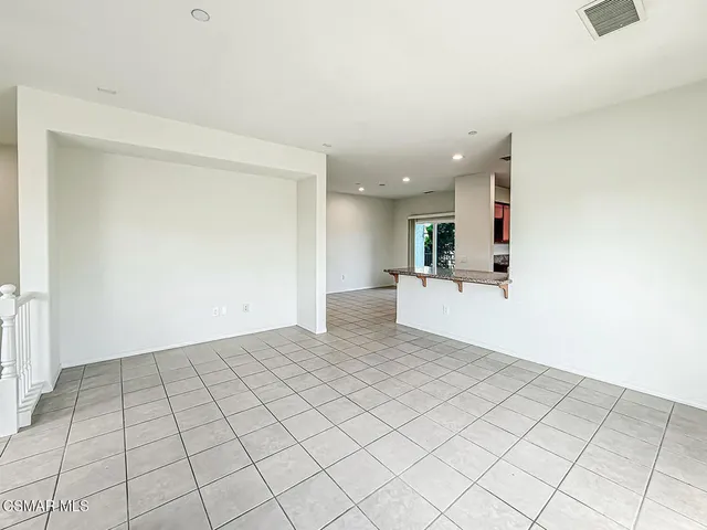 a view of a kitchen with a sink and a window