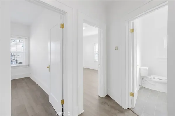 a view of a bathroom from a hallway