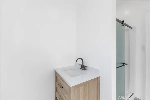 a bathroom with a sink and mirror