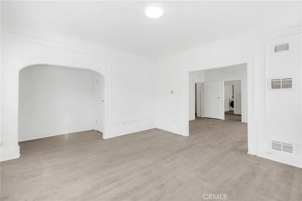 an empty room with closet area