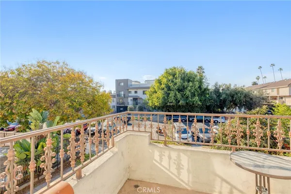 a view of balcony with furniture