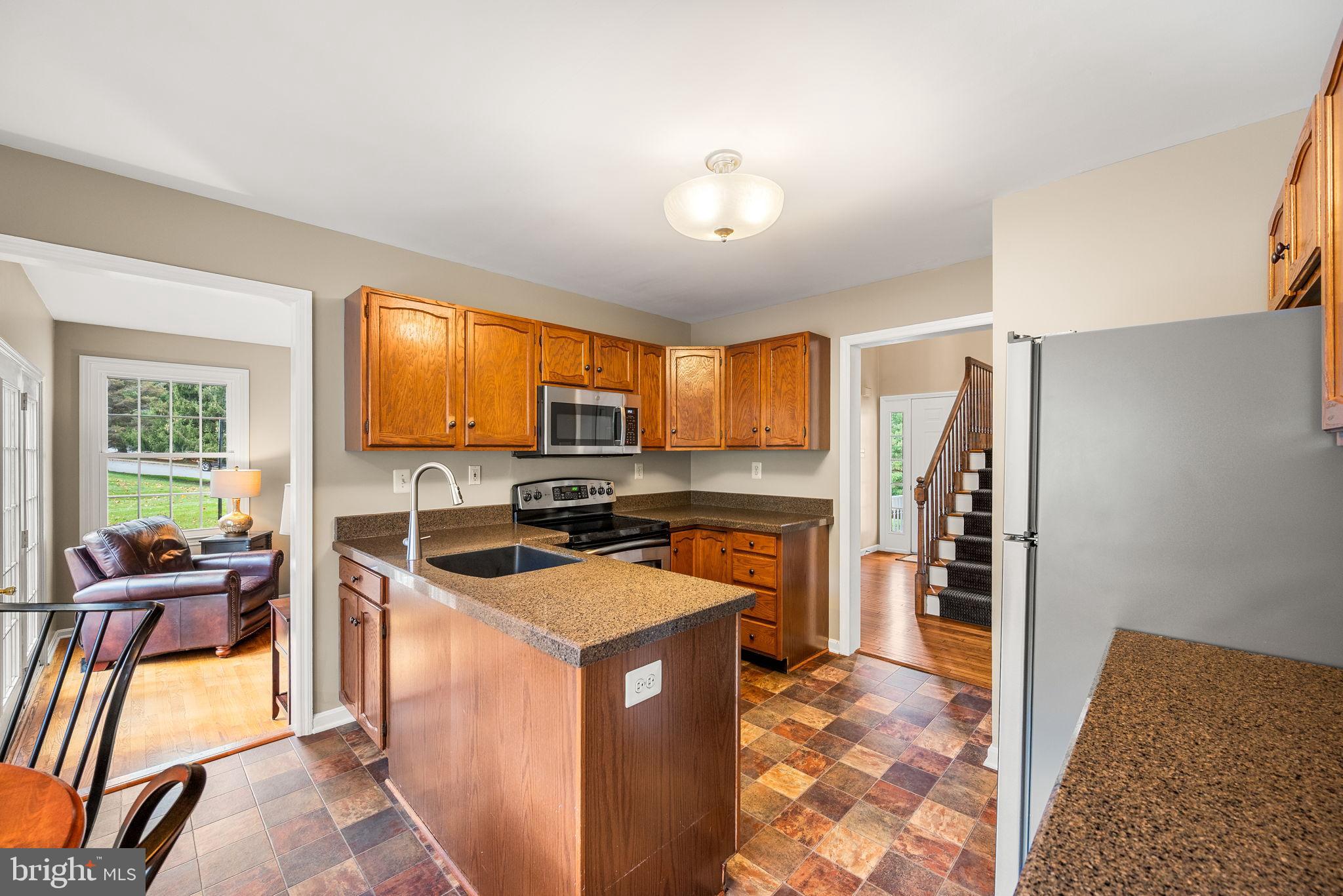 4 Pierce Lane Downingtown, PA 19335 - Photo 13 of 43 a kitchen that has a cabinets counter space appliances and a window