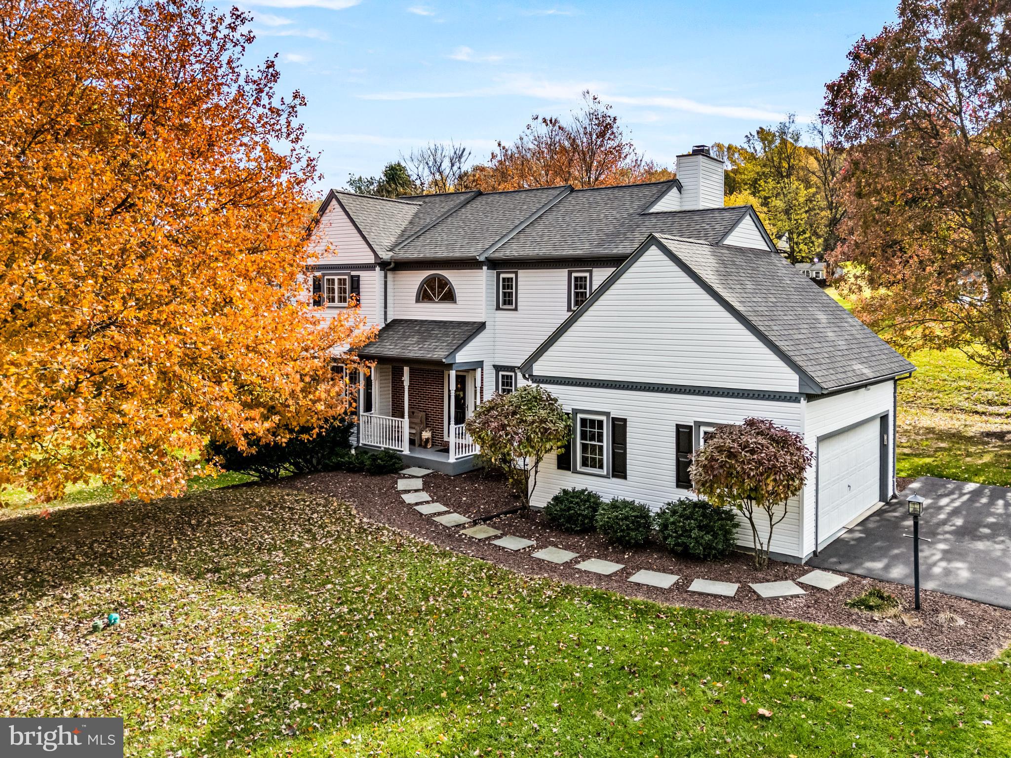 4 Pierce Lane Downingtown, PA 19335 - Photo 2 of 43 front view of a house with a small yard