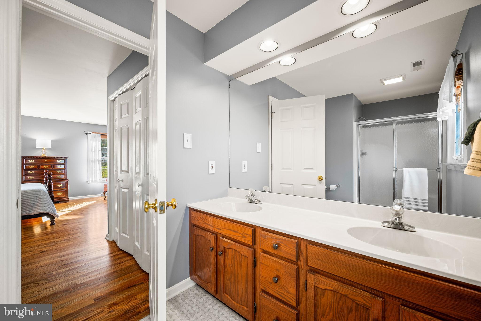 4 Pierce Lane Downingtown, PA 19335 - Photo 22 of 43 a spacious bathroom with a double vanity sink shower and a mirror