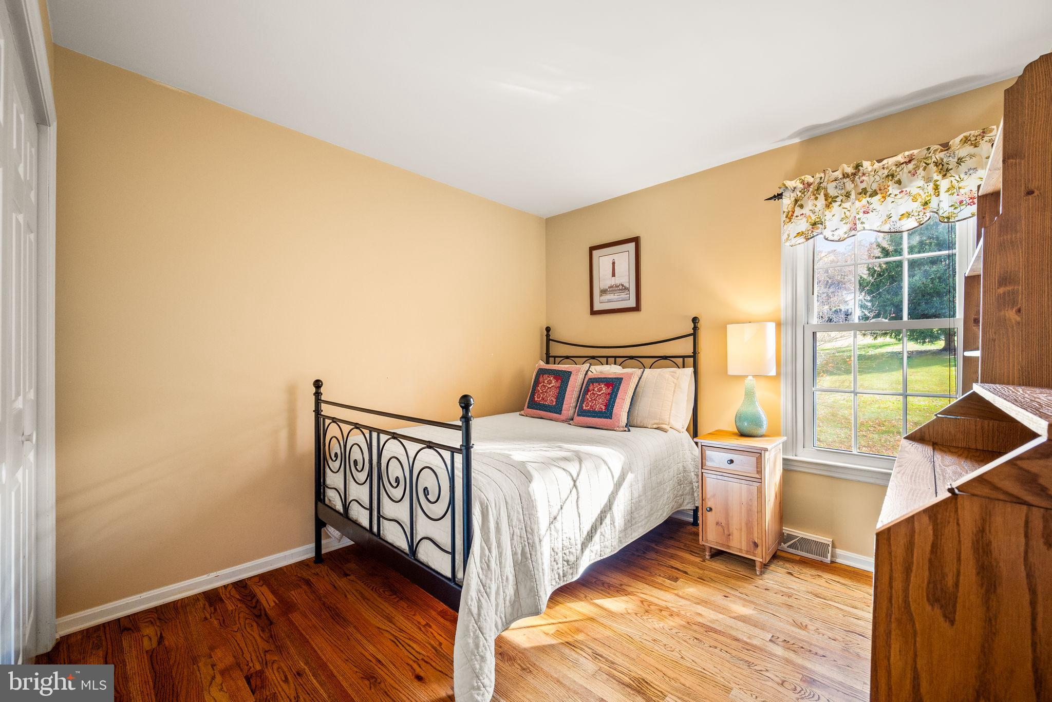 4 Pierce Lane Downingtown, PA 19335 - Photo 24 of 43 a bedroom with a bed and glass door