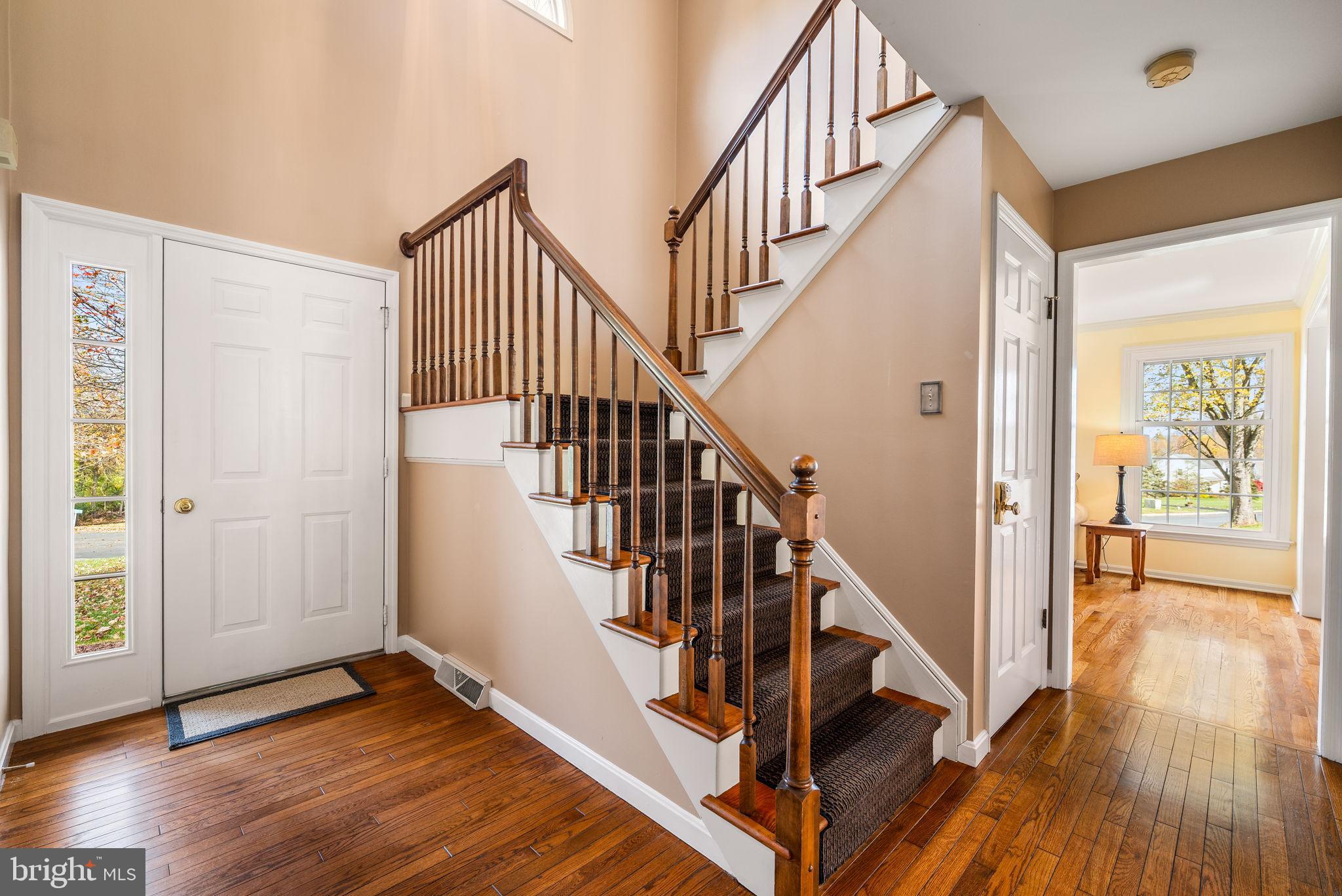 4 Pierce Lane Downingtown, PA 19335 - Photo 10 of 43 a view of an entryway with wooden floor and door