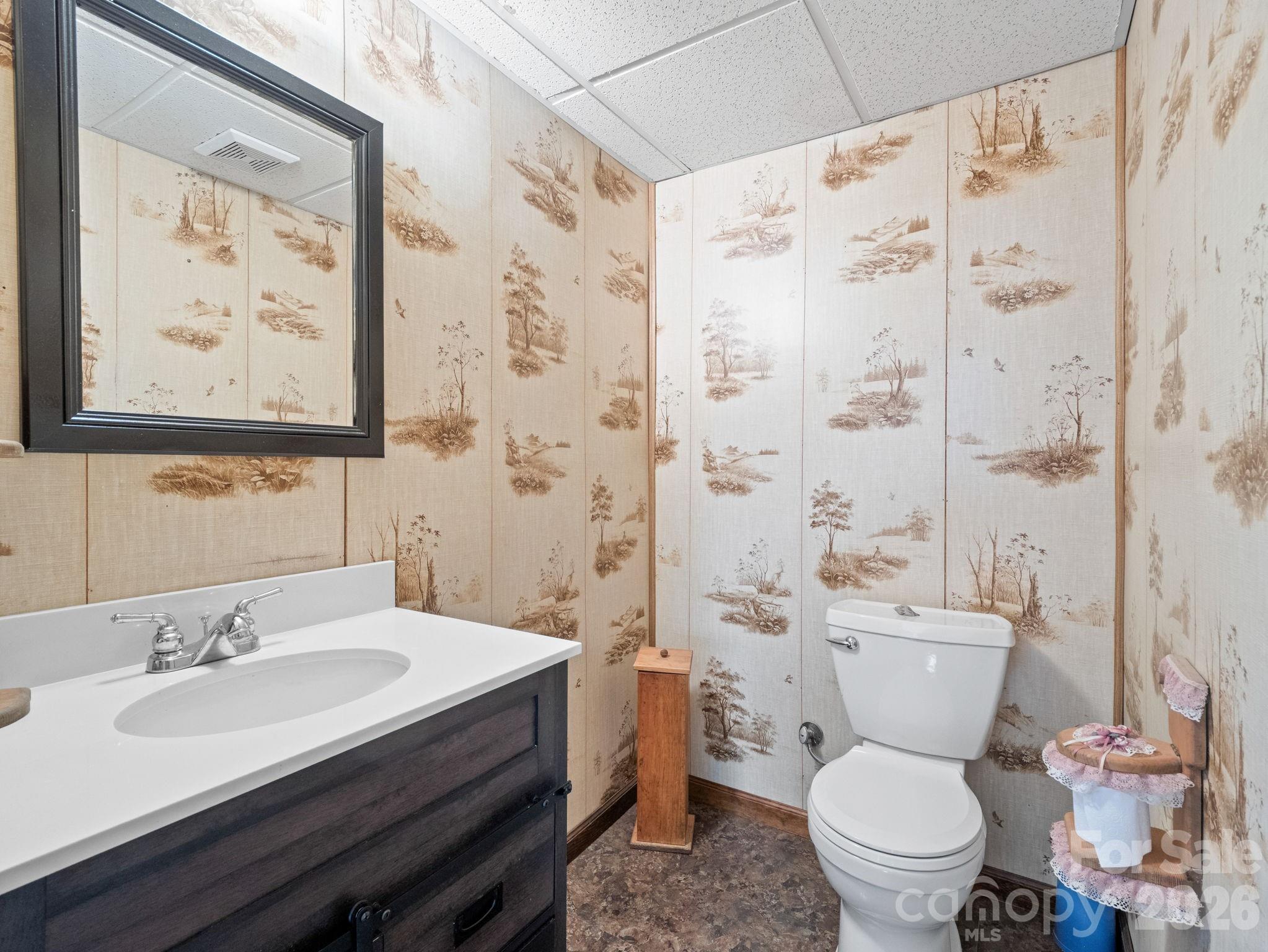 111 Buckeye Road Lake Lure, NC 28746 - Photo 26 of 48 a bathroom with a sink toilet and shower
