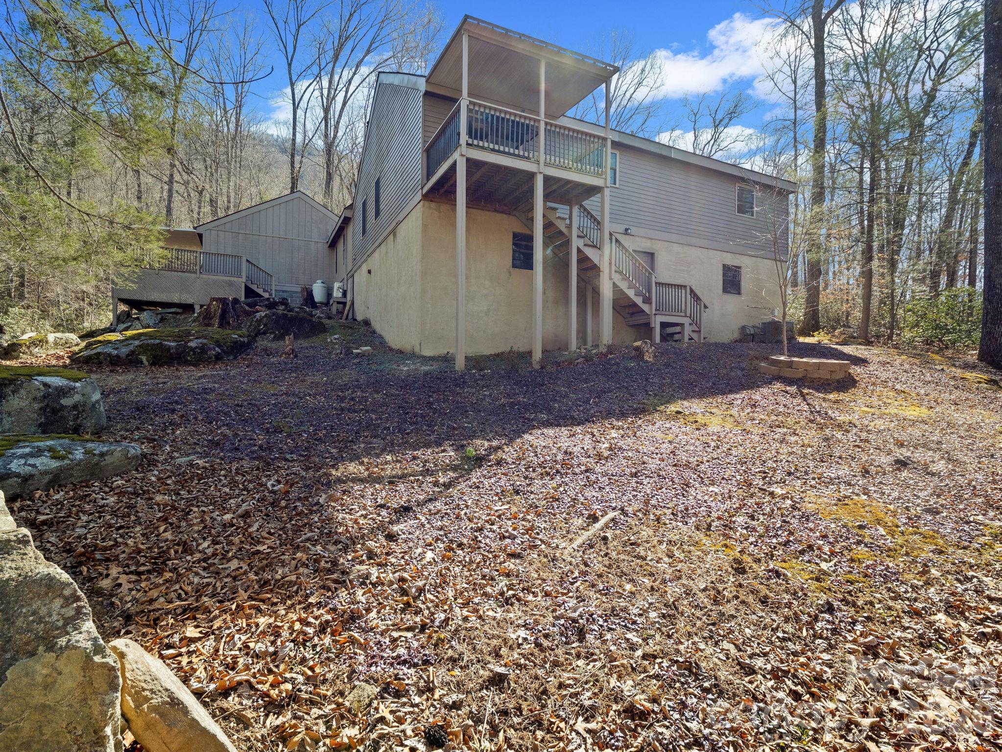 111 Buckeye Road Lake Lure, NC 28746 - Photo 35 of 48 a view of a house with a yard