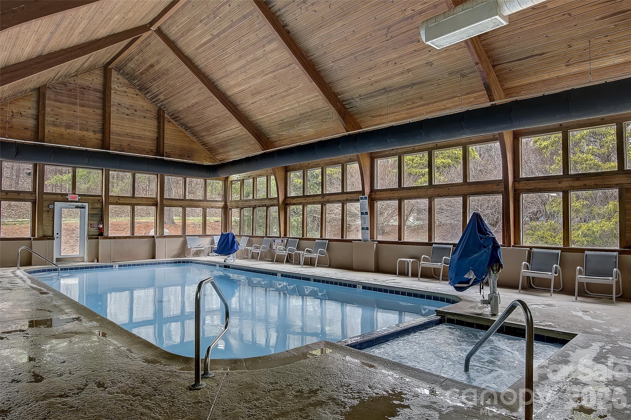 111 Buckeye Road Lake Lure, NC 28746 - Photo 45 of 48 a living room with furniture pool table and a large window