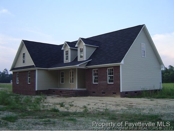 2946 Wade-Stedman Road Stedman, NC 28391 - Photo 1 of 4 a front view of a house with a garden