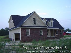 2946 Wade-Stedman Road Stedman, NC 28391 - Photo 3 of 4 a front view of a house with garden