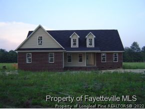 2946 Wade-Stedman Road Stedman, NC 28391 - Photo 4 of 4 a view of a big house with a yard