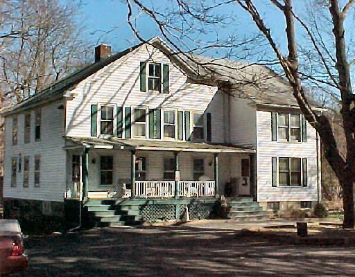63 West Lane Ridgefield, CT 06877 - Photo 1 of 1 a front view of a house with a yard