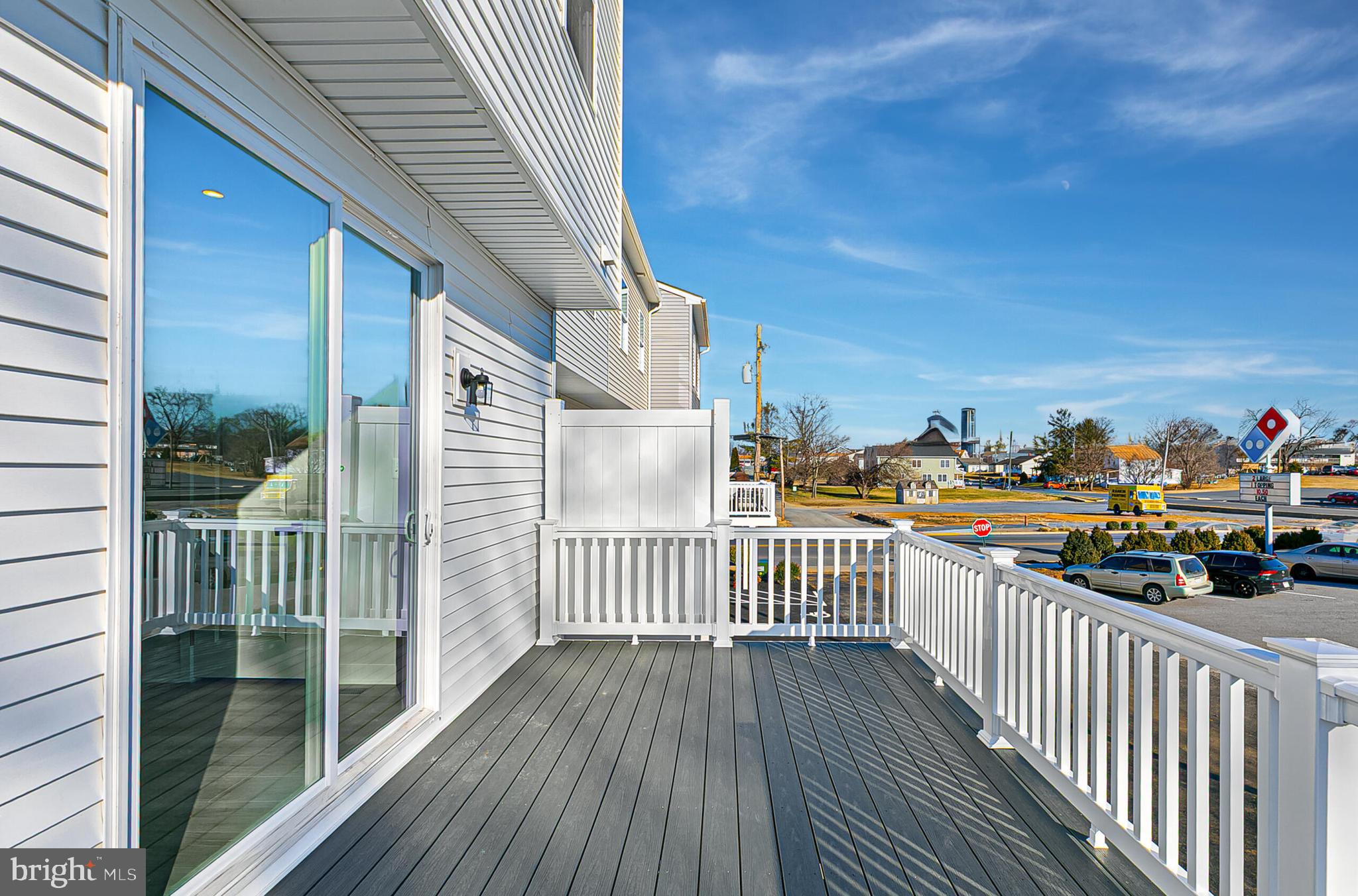 64 F Oasis Avenue Ranson, WV 25438 - Photo 19 of 39 a view of a balcony with wooden fence