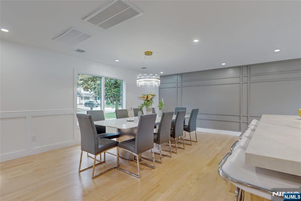 415 Bailey Road Paramus, NJ 07652 - Photo 16 of 44 a view of a dining room with furniture and wooden floor