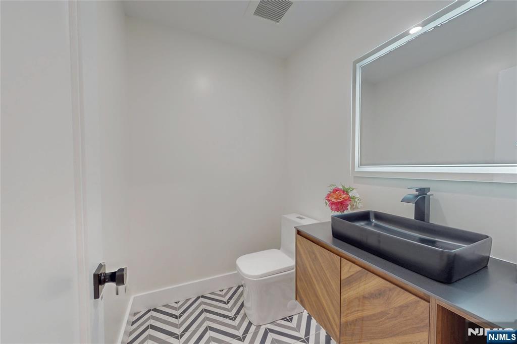 415 Bailey Road Paramus, NJ 07652 - Photo 22 of 44 a bathroom with a sink and a toilet