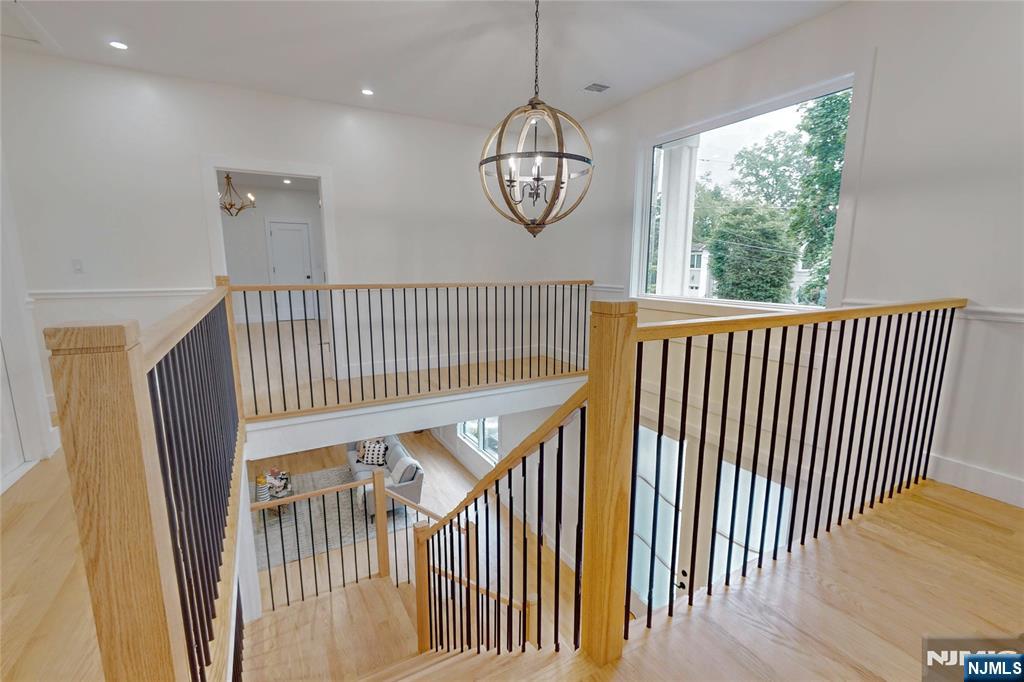 415 Bailey Road Paramus, NJ 07652 - Photo 24 of 44 a view of a hallway with wooden floor and a window