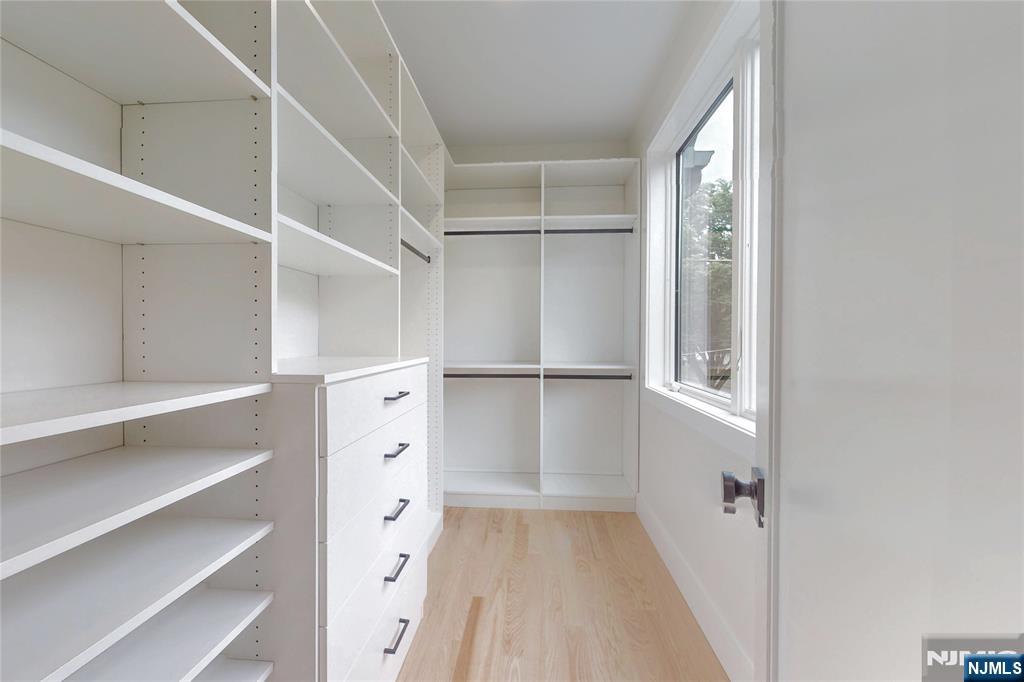 415 Bailey Road Paramus, NJ 07652 - Photo 30 of 44 a view of walk in closet with empty racks