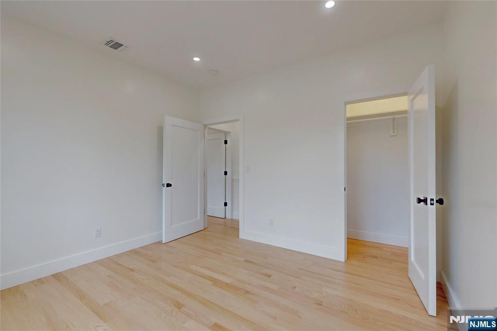 415 Bailey Road Paramus, NJ 07652 - Photo 32 of 44 a view of a big room with wooden floor and closet