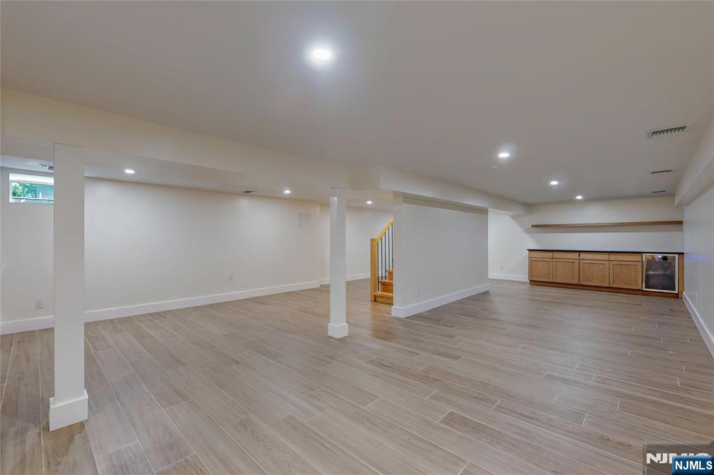 415 Bailey Road Paramus, NJ 07652 - Photo 35 of 44 an empty room with wooden floor and window