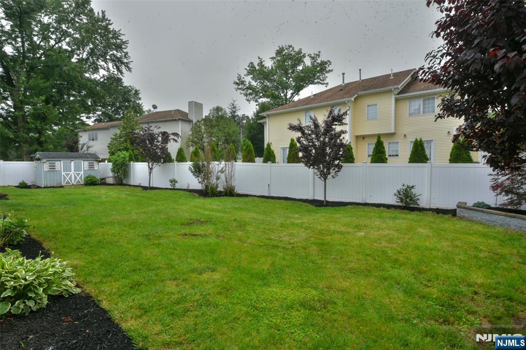 415 Bailey Road Paramus, NJ 07652 - Photo 39 of 44 a view of a house with backyard and a tree