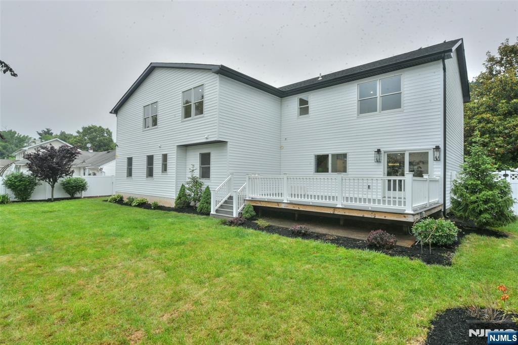 415 Bailey Road Paramus, NJ 07652 - Photo 40 of 44 a front view of a house with a garden