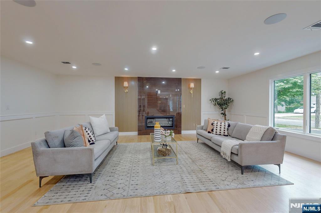 415 Bailey Road Paramus, NJ 07652 - Photo 4 of 44 a living room with furniture and a large window