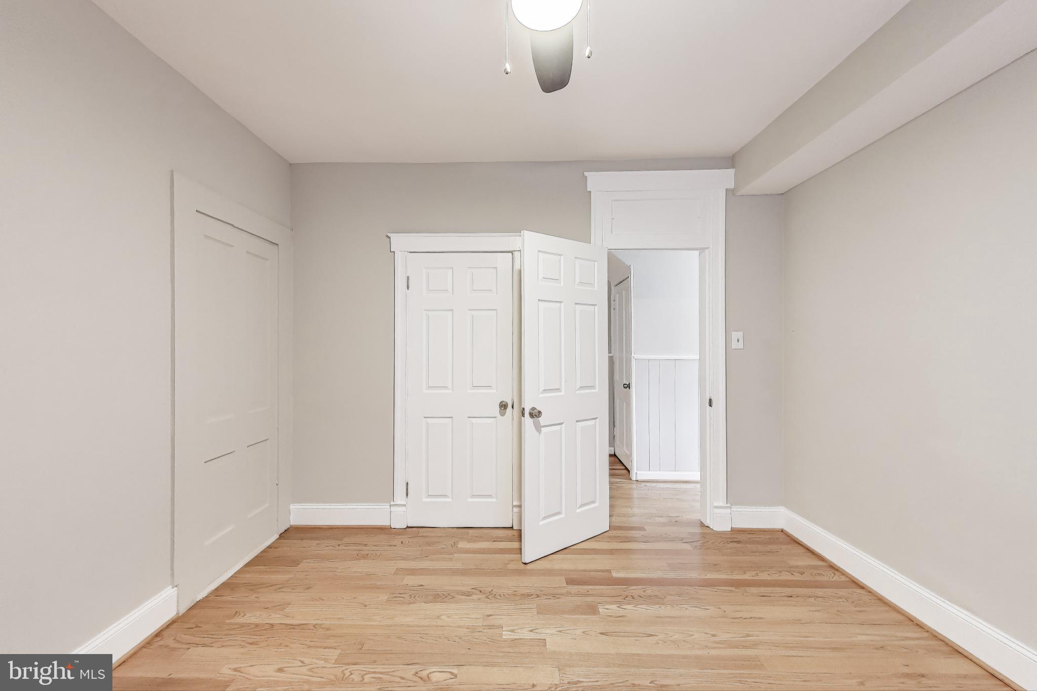 212 Elm Street Northwest Washington, DC 20001 - Photo 15 of 50 a view of an empty room and wooden floor