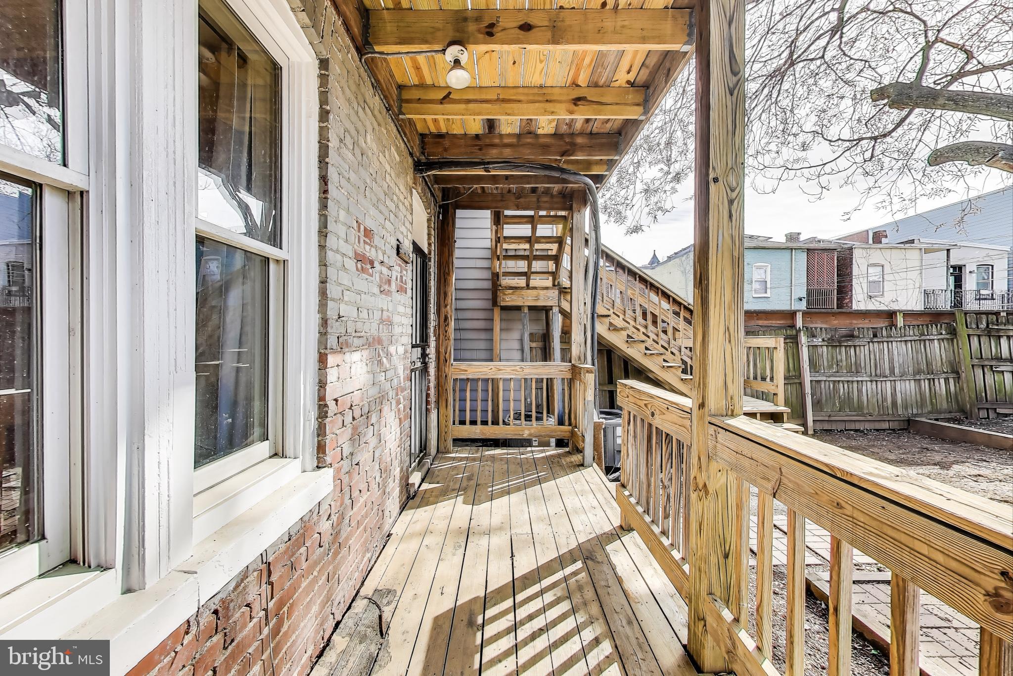 212 Elm Street Northwest Washington, DC 20001 - Photo 21 of 50 a view of a balcony with wooden floor and stairs