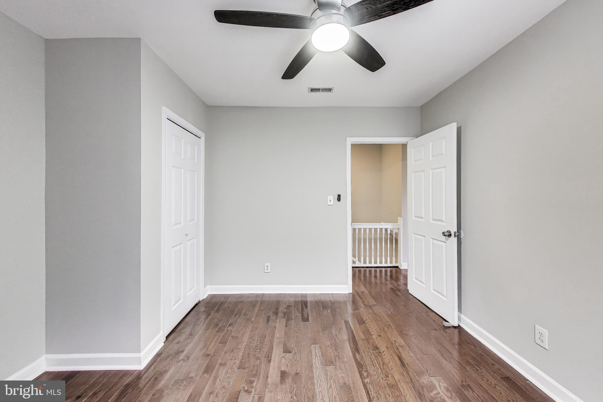 212 Elm Street Northwest Washington, DC 20001 - Photo 37 of 50 a view of empty room with wooden floor