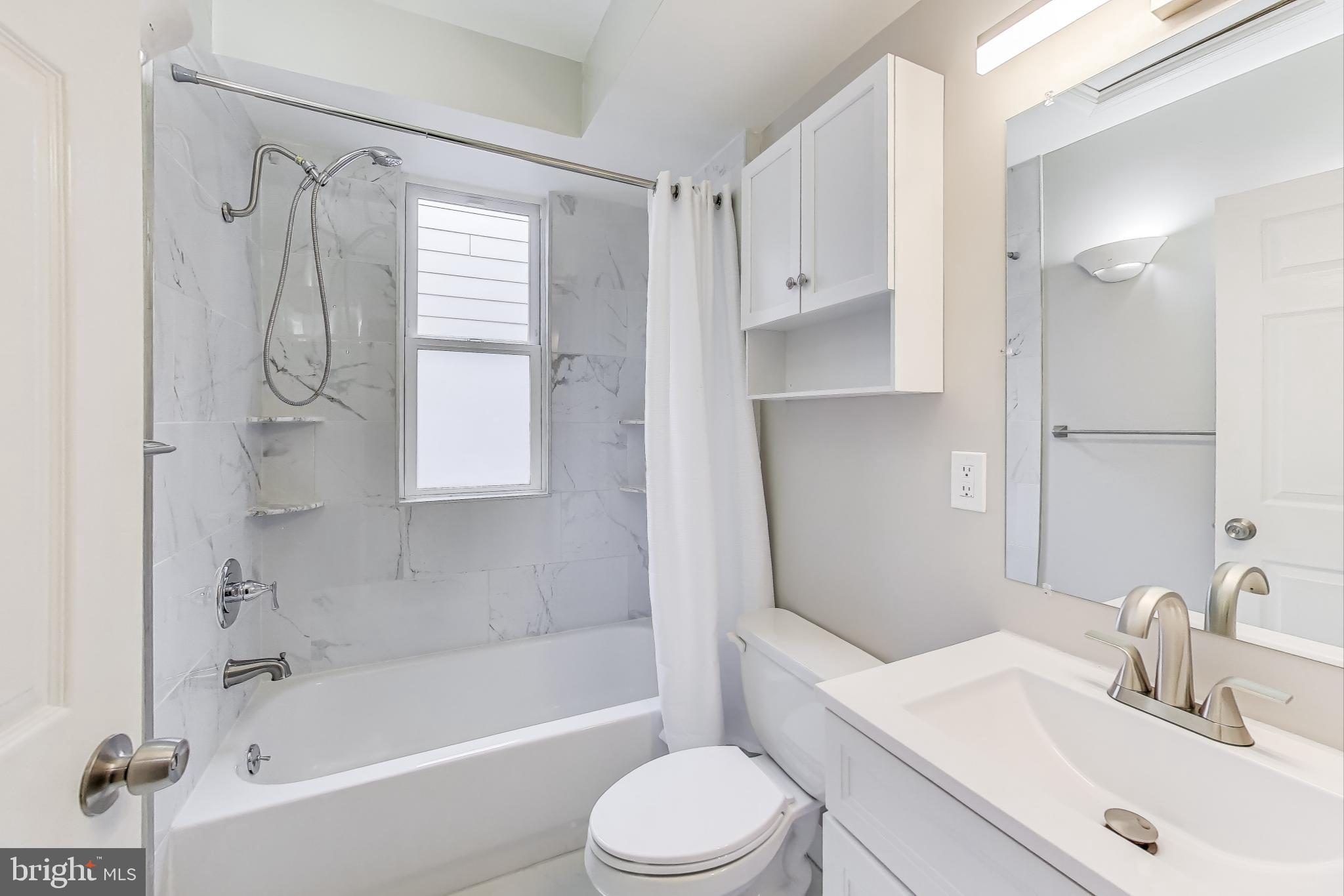 212 Elm Street Northwest Washington, DC 20001 - Photo 38 of 50 a bathroom with a sink toilet and shower