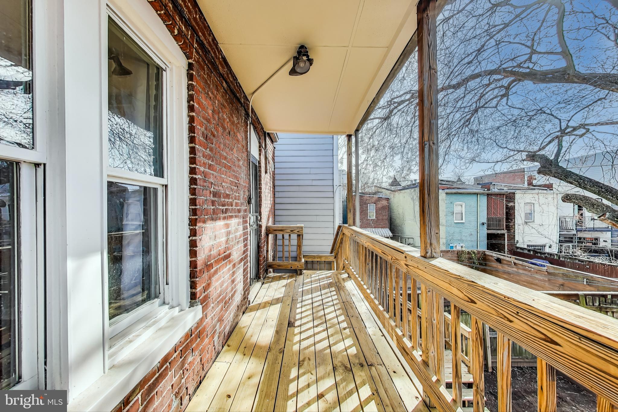 212 Elm Street Northwest Washington, DC 20001 - Photo 41 of 50 a view of a balcony with two chairs
