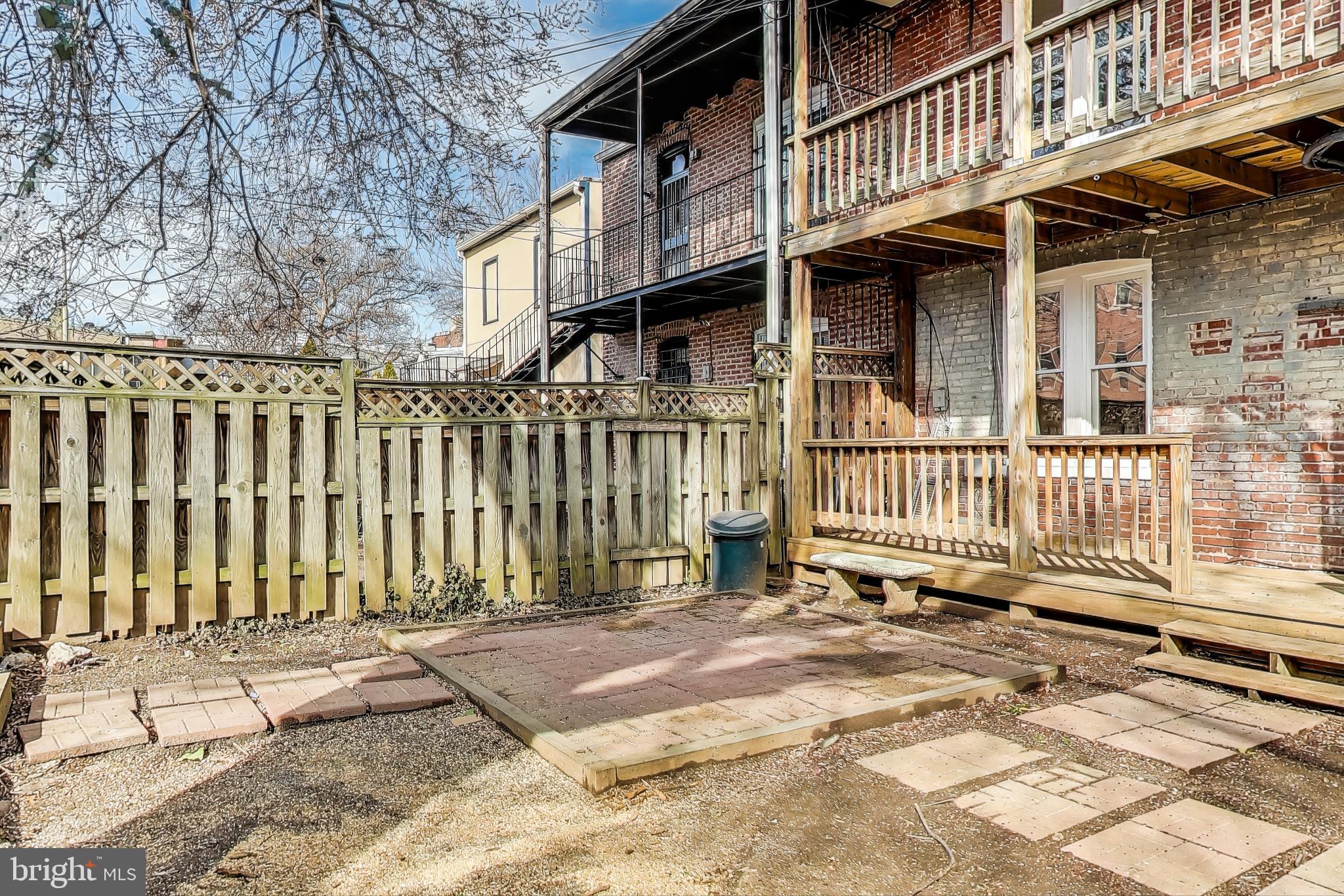 212 Elm Street Northwest Washington, DC 20001 - Photo 45 of 50 a backyard of a house with a deck