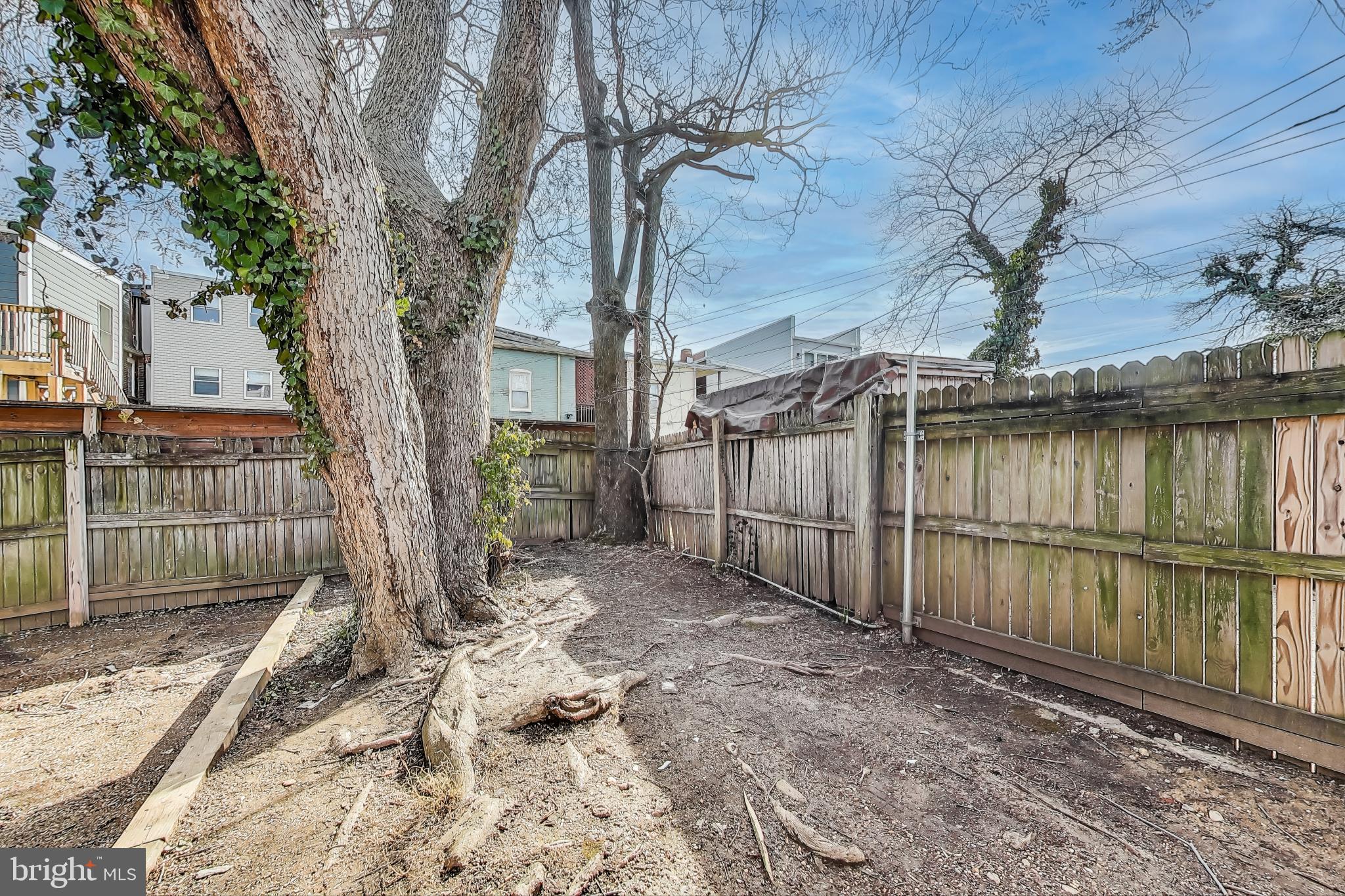 212 Elm Street Northwest Washington, DC 20001 - Photo 48 of 50 a backyard of a house with a small barn