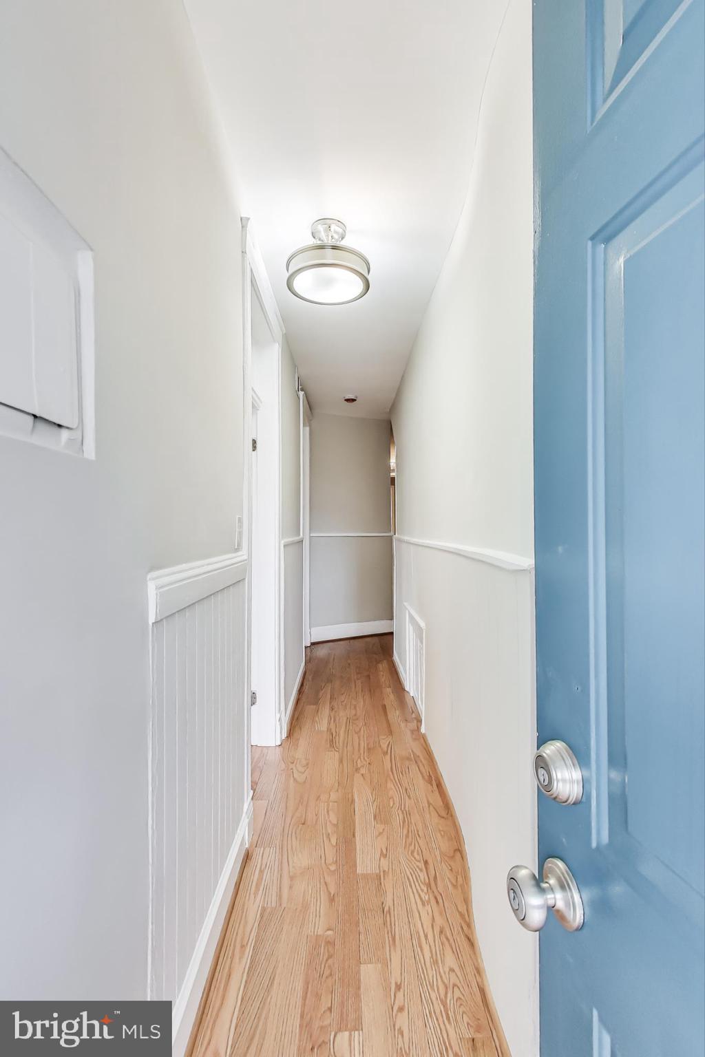 212 Elm Street Northwest Washington, DC 20001 - Photo 5 of 50 a view of a hallway with wooden floor and cabinet