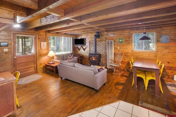 a spacious bedroom with a bed and a table with chair