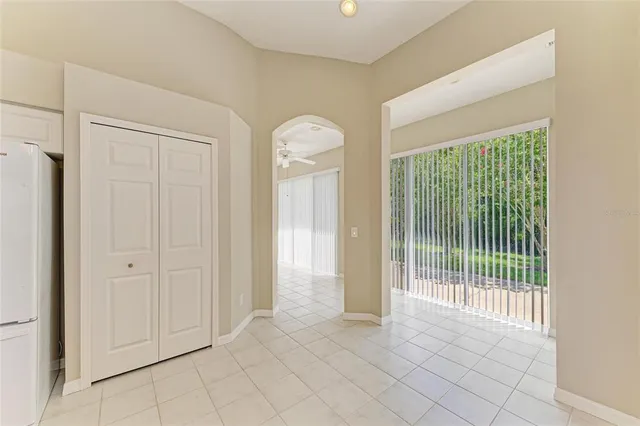 a bathroom with a bathtub a sink a vanity a window and a mirror