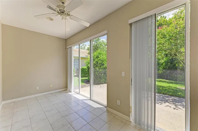 an aerial view of a house with a yard and lake view