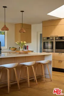 a kitchen with a table and chairs in it