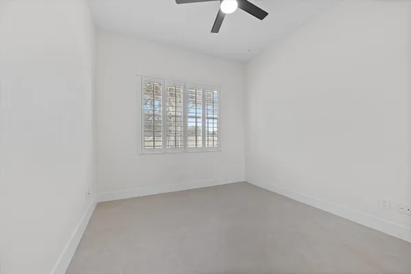 a bathroom with a granite countertop sink a toilet and a shower