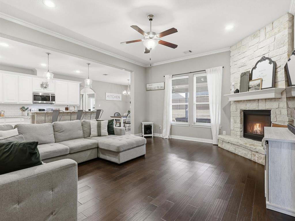 810 Chestnut Grove Drive Cleburne, TX 76033 - Photo 14 of 40 a living room with furniture and a fireplace