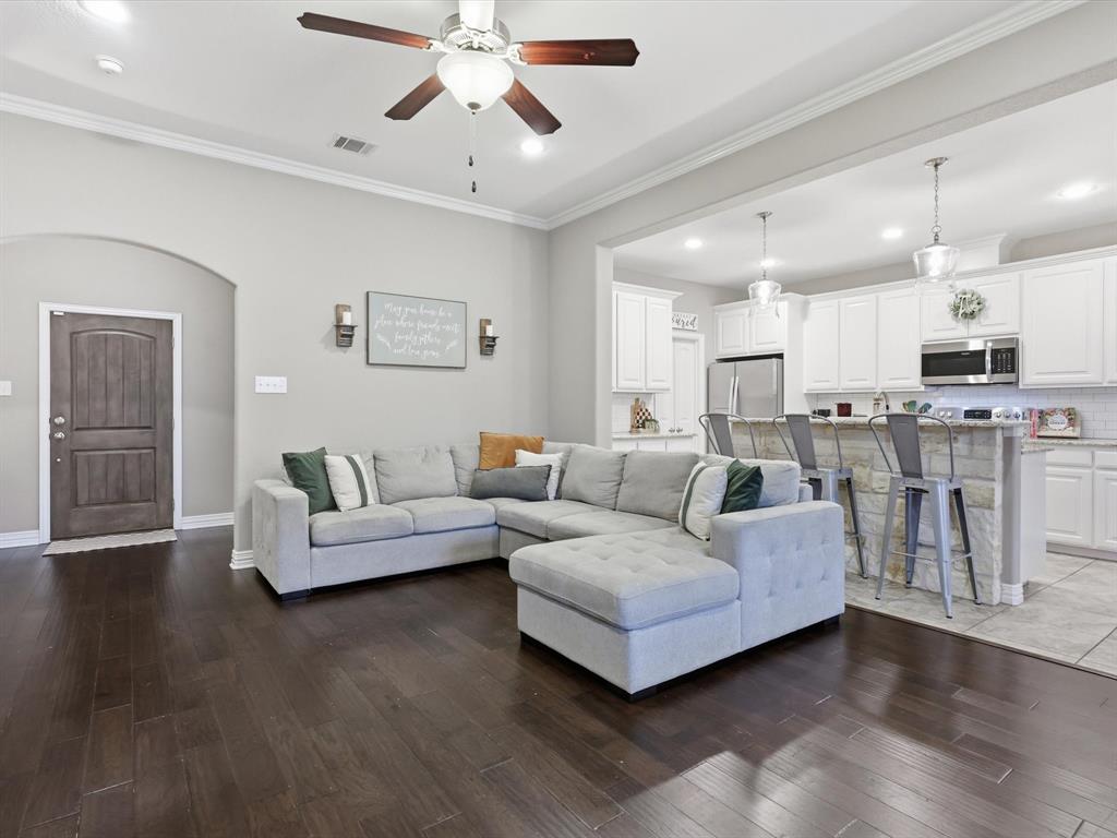 810 Chestnut Grove Drive Cleburne, TX 76033 - Photo 15 of 40 a living room with furniture and a wooden floor