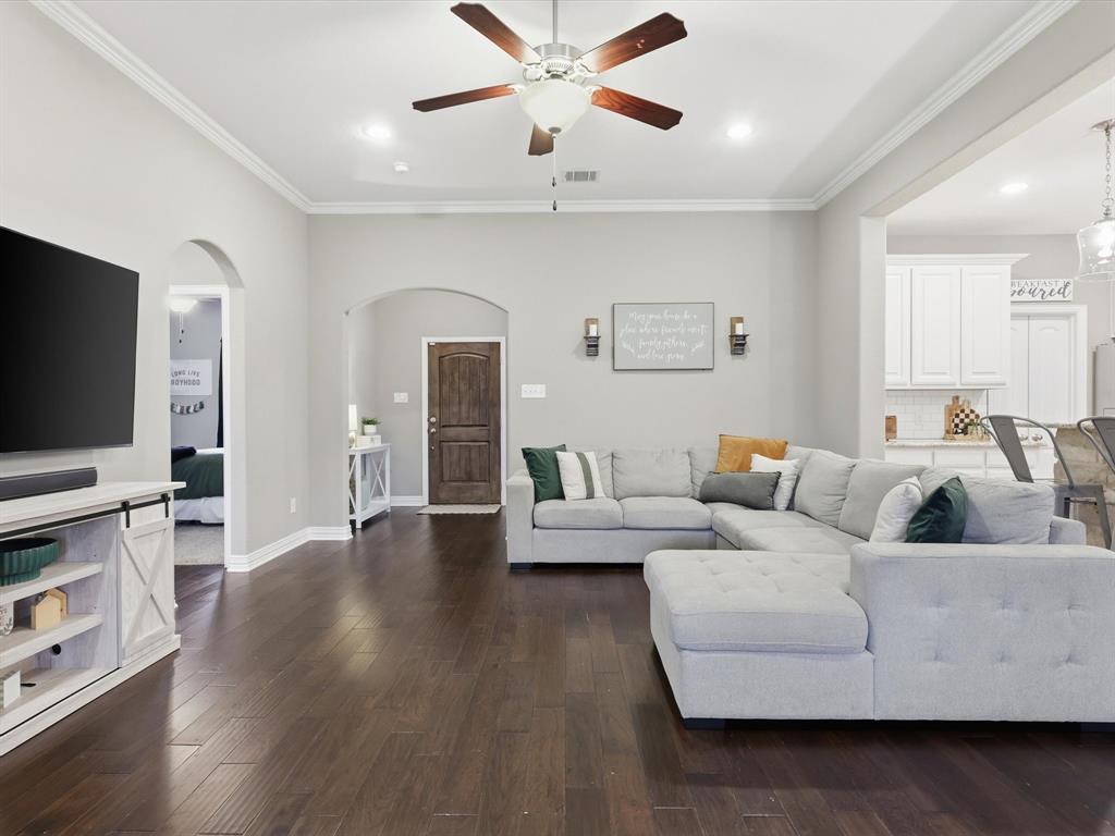 810 Chestnut Grove Drive Cleburne, TX 76033 - Photo 16 of 40 a living room with furniture and a flat screen tv